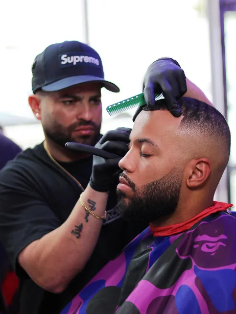 Barber detailing a client's hairline